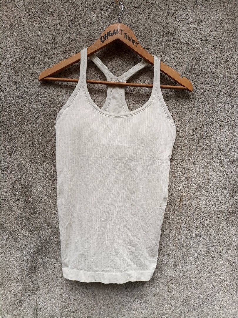 Lululemon Ribbed Racerback Tank Top Cream (Category: Sleeveless) located in Maasim. Submitted by ukayganda25 (Listing ID 1461796964, Image 1). Description: - Lululemon cream ribbed tank top - Racerback style - Subtle logo detail on the back - Comfortable and stretchy material - Perfect for workouts or casual outfits - Pairs well with shorts or leggings.