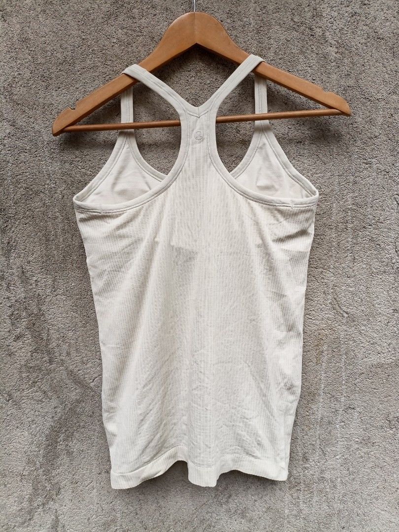 Lululemon Ribbed Racerback Tank Top Cream (Category: Sleeveless) located in Maasim. Submitted by ukayganda25 (Listing ID 1461796964, Image 2). Description: - Lululemon cream ribbed tank top - Racerback style - Subtle logo detail on the back - Comfortable and stretchy material - Perfect for workouts or casual outfits - Pairs well with shorts or leggings.