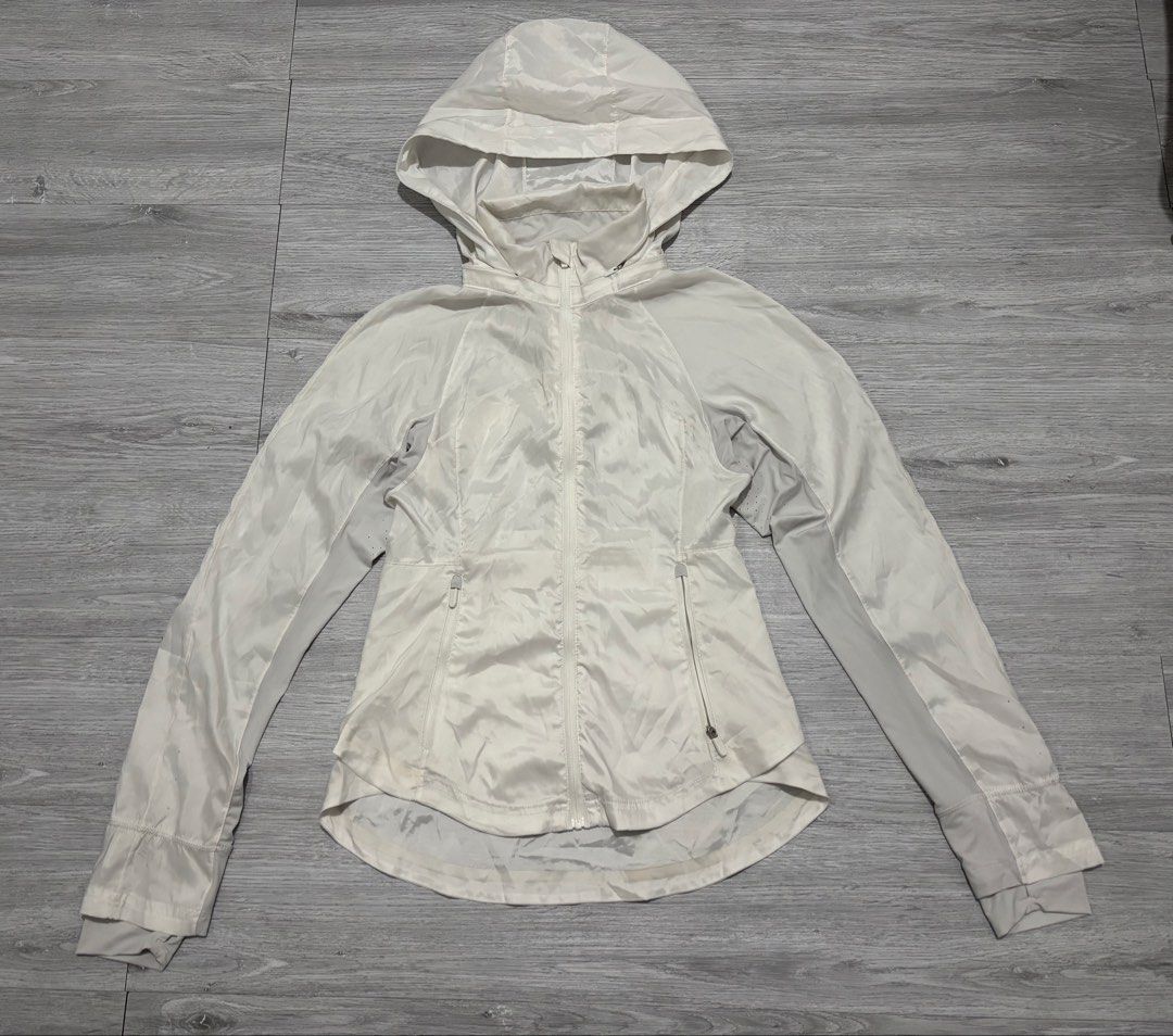 Lululemon White Hooded Lightweight Jacket Size 6 (Category: Coats, Jackets and Outerwear) located in Manila. Submitted by kenriegab (Listing ID 1461662382, Image 1). Description: - White Lululemon hooded jacket - Size 6 - Lightweight material (Polyester/Elastane) - Ideal for layering or light workouts - Full zip front - Zippered pockets - Adjustable hood Dimes: L 21.5 Back 24.5 Weigth : 15 Excellent condition Need wash Minor issue sa last pic yun