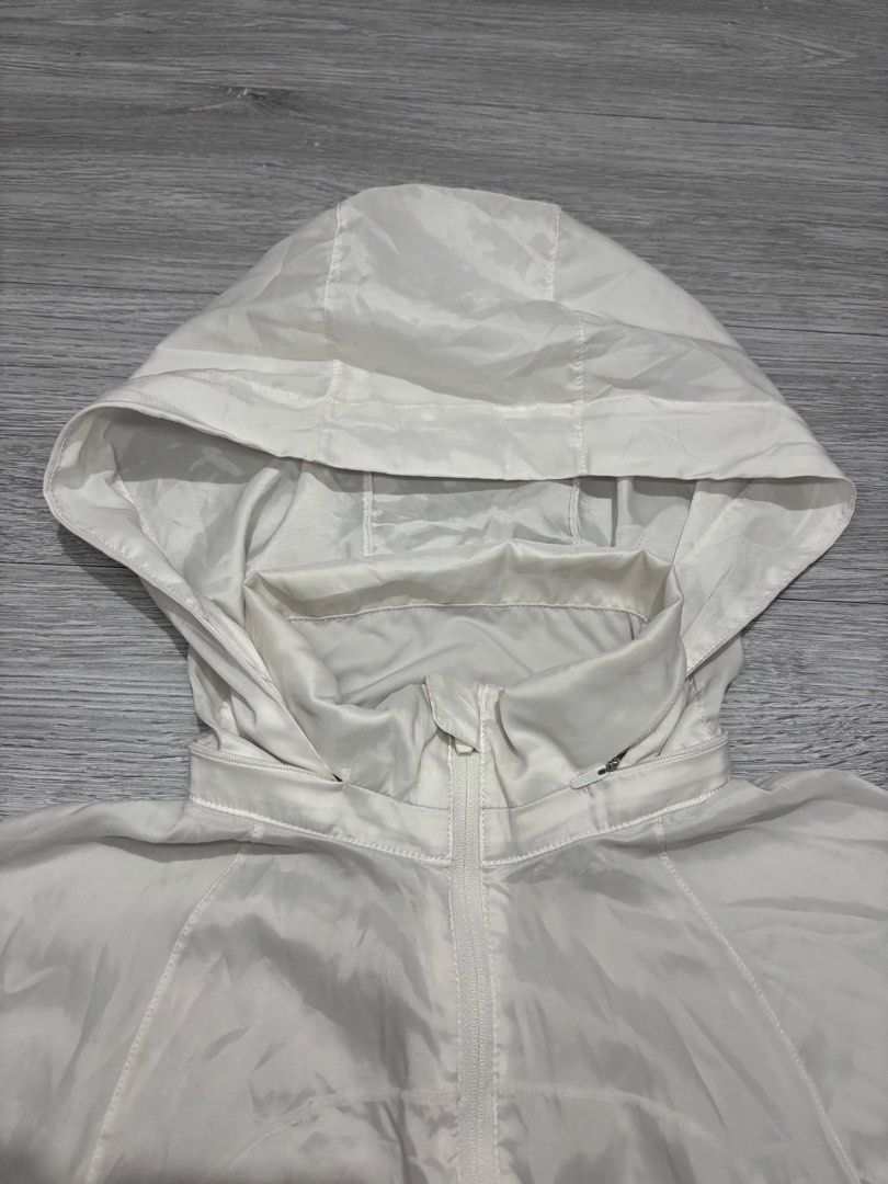 Lululemon White Hooded Lightweight Jacket Size 6 (Category: Coats, Jackets and Outerwear) located in Manila. Submitted by kenriegab (Listing ID 1461662382, Image 2). Description: - White Lululemon hooded jacket - Size 6 - Lightweight material (Polyester/Elastane) - Ideal for layering or light workouts - Full zip front - Zippered pockets - Adjustable hood Dimes: L 21.5 Back 24.5 Weigth : 15 Excellent condition Need wash Minor issue sa last pic yun