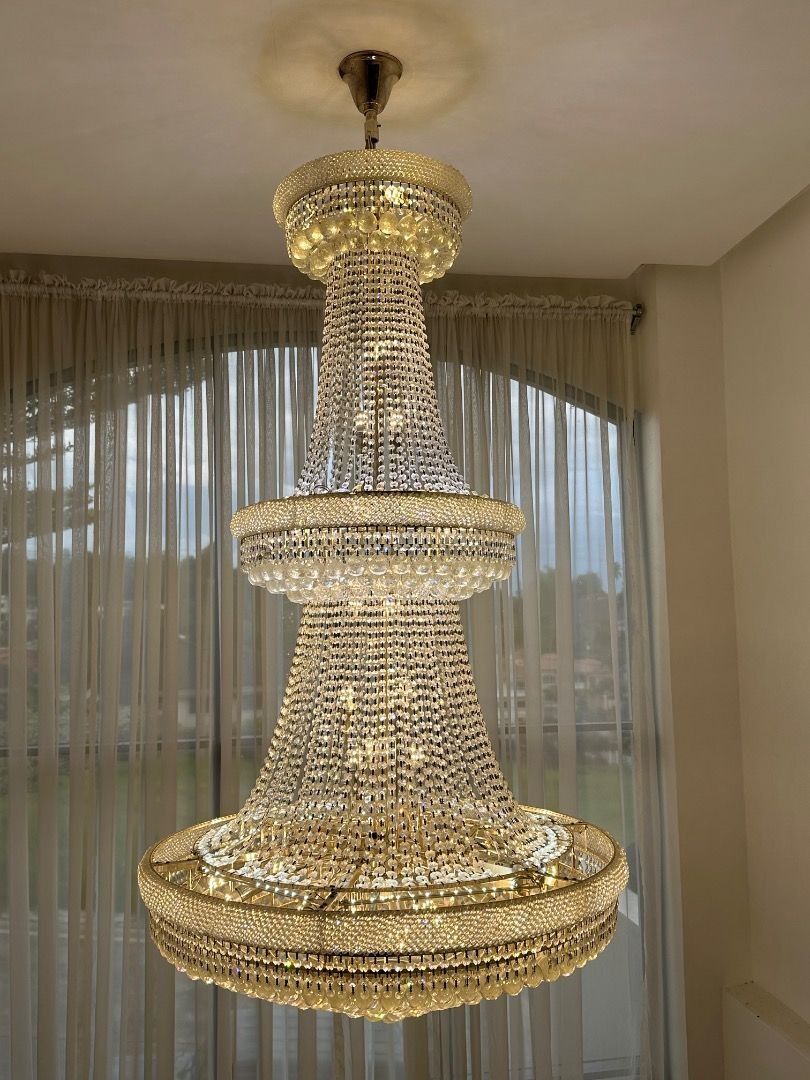 Luxury Crystal Chandelier (Category: Lighting) located in Davao. Submitted by emmabasoc (Listing ID 1461582952, Image 3). Description: - Beautiful multi-tiered chandelier - Features sparkling crystals and elegant gold accents - Creates a grand and luxurious atmosphere - Ideal for dining rooms or living areas - Illuminates your space beautifully - Ready for installation.