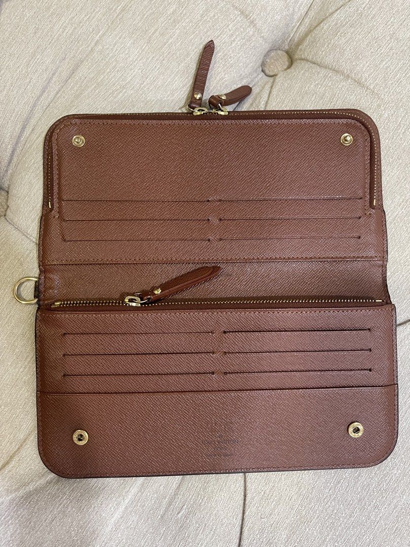 LV Insolite Wallet with Entrupy (Category: Luxury Bags & Wallets) located in Manila. Submitted by sa.edit (Listing ID 1461628157, Image 3). Description: LV Monogram Insolite Wallet Made in Spain Material: Monogram coated canvas, cross-grain leather lining Color: Classic brown interior, gold-tone hardware Inclusions: dustbag, entrupy certificate Measurements: 8.4” L x 4.25” H Excellent condition. Barely noticeable hot-stamped initials. Clean inter
