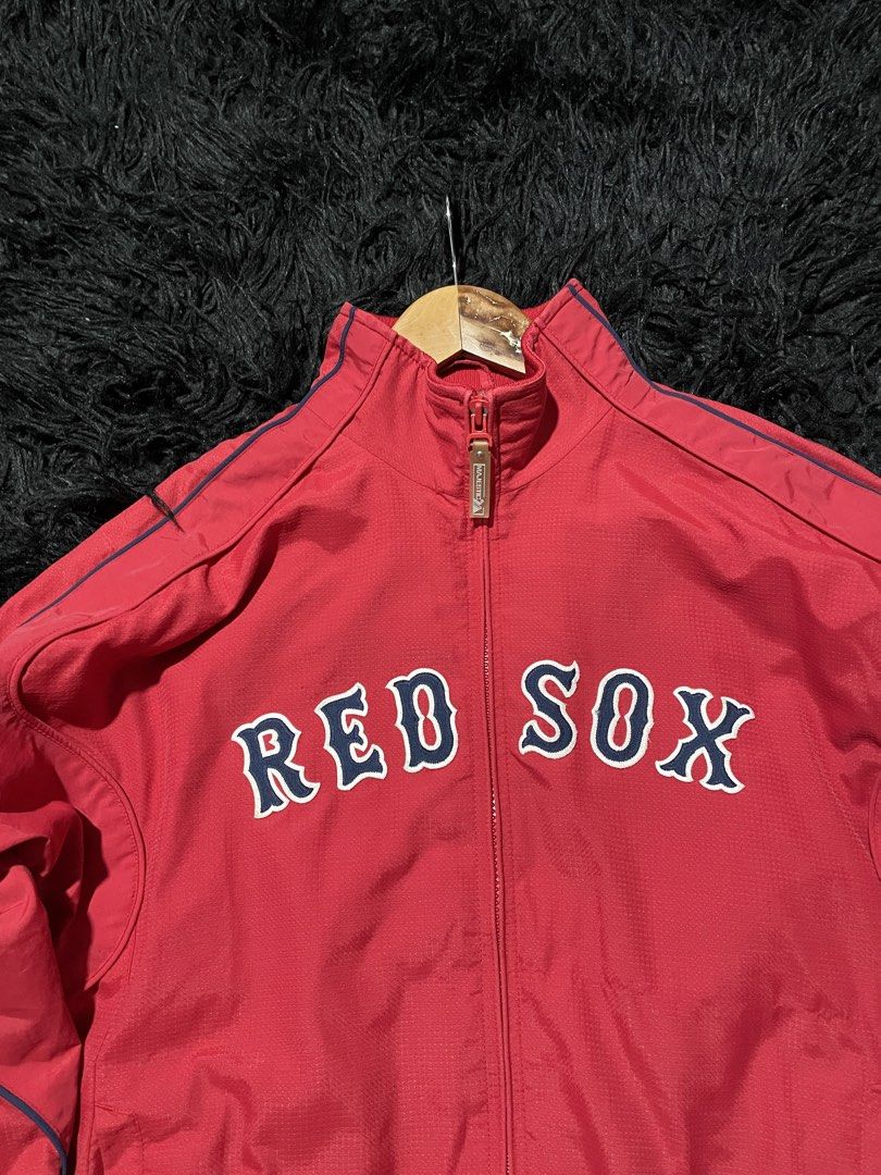 Majestic Red Sox Baseball Jacket (Category: Coats, Jackets and Outerwear) located in Munoz. Submitted by bb_jimbo0 (Listing ID 1461746571, Image 2). Description: - Cool red jacket for any Red Sox fan. - Features the team name prominently across the chest. - Includes the official MLB logo on the back. - Majestic branding on the sleeve. - Convenient zipper closure. - Ideal for wearing to games or for everyday casual style. 22 W 27 L.