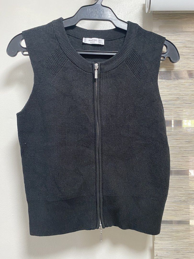Mango Black Knit Zip-Up Vest Size S (Category: Sleeveless) located in Cavite. Submitted by yc.shoppemnl (Listing ID 1461601249, Image 1). Description: - Brand: Mango - Color: Black - Type: Knit Vest - Design: Sleeveless, full zip-up front - Texture: Ribbed - Size: S - Style: Great for layering -once lang nagamit.