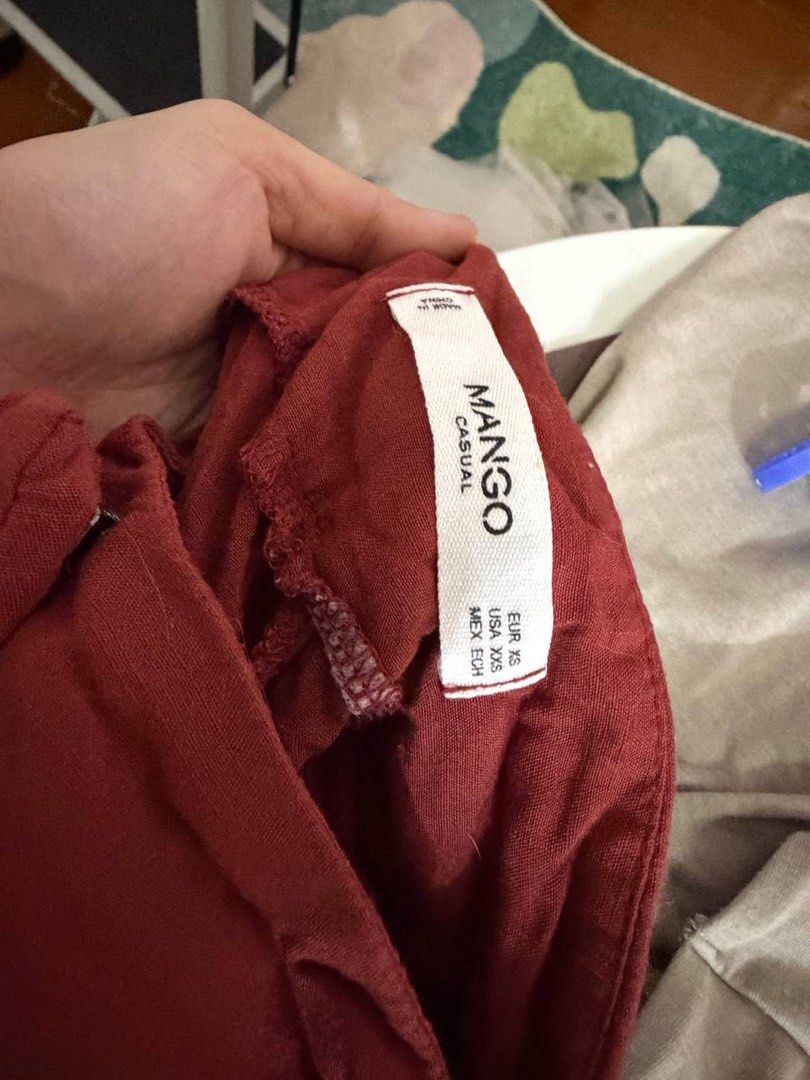 Mango Casual Culottes - Rust Red - Size XS (Category: Other Bottoms) located in Quezon City. Submitted by patzyy (Listing ID 1461602424, Image 3). Description: - Brand: Mango - Color: Rust Red - Style: Culottes - Waist: High-waisted - Fit: Wide leg, cropped length - Features: Tie belt - Fabric: Lightweight, crinkled - Occasion: Casual day out or dressing up.