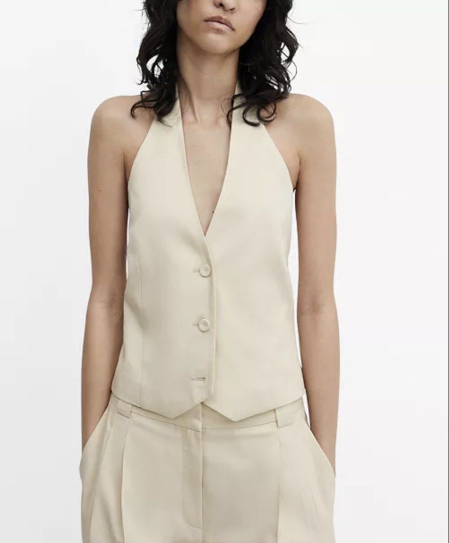 MANGO Lyocell Halter Waistcoat (Category: Sleeveless) located in Manila. Submitted by bianxaakes (Listing ID 1461795009, Image 3). Description: - medium size - used this only once 😫 in very good condition! - very flattering, especially for ppl with big boobies! - delivery shouldered by buyer - mop: gcash / bank transfer.