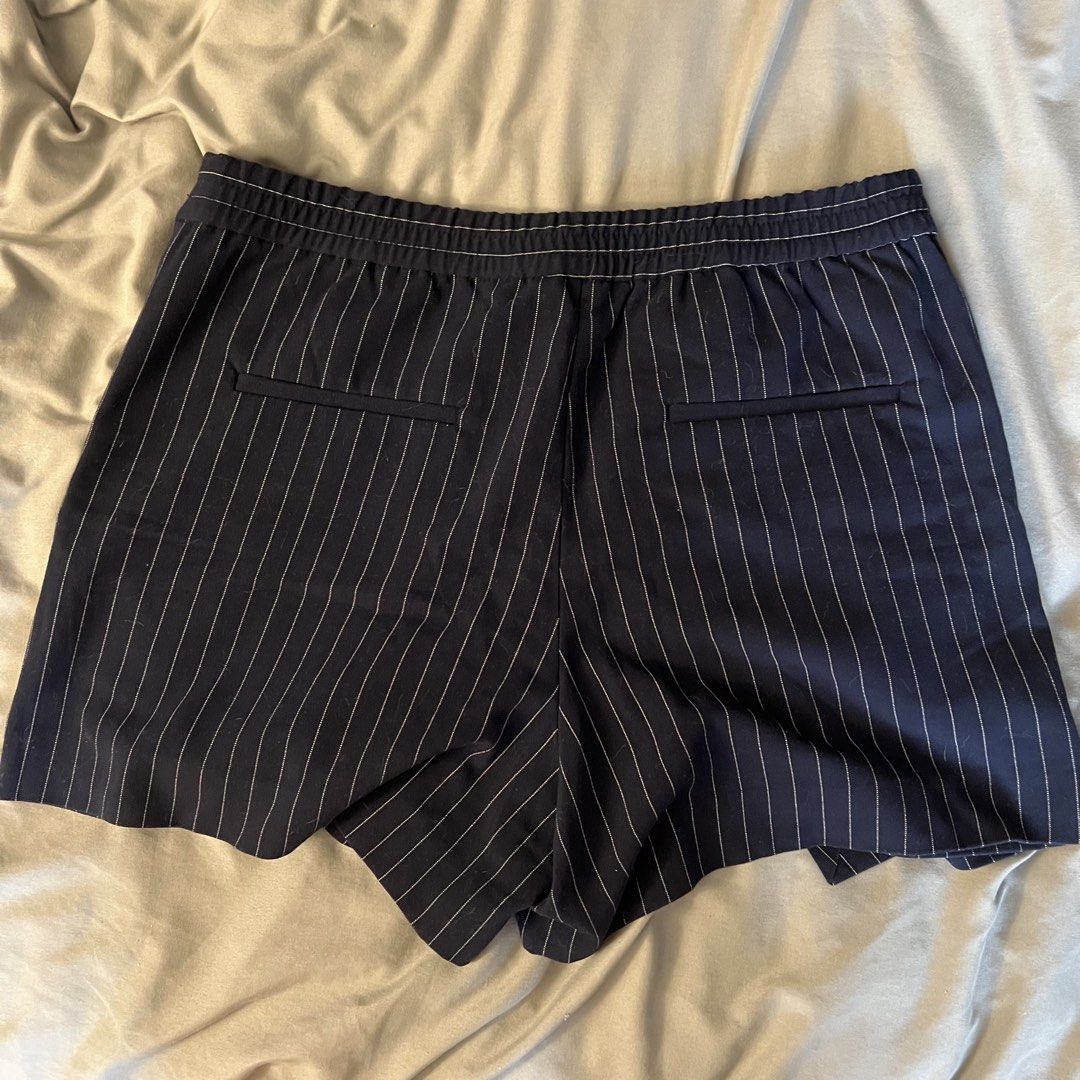 Mango Pinstripe Skort Size XS (Category: Shorts) located in Pasig City. Submitted by cormatzu (Listing ID 1461645704, Image 3). Description: - Mango navy blue skort - White pinstripe detail - Comfortable elastic waistband - Functional front pockets, decorative back pockets - Perfect for casual or dressed-up looks - Made in Vietnam.