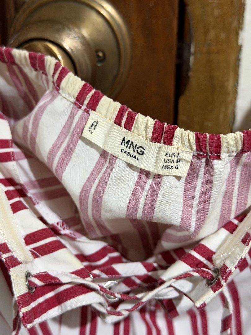 Mango red and white stripe puff sleeve corset top (Category: Blouses) located in Quezon City. Submitted by latiendadejaye (Listing ID 1461624171, Image 3). Description: Purchased from Mango store US Size M Worn a few times, some fraying on the inner part of the top and some yellowing on the garter at the back MOP: BPI, Gcash, Maya RFS: cleaning out my closet.