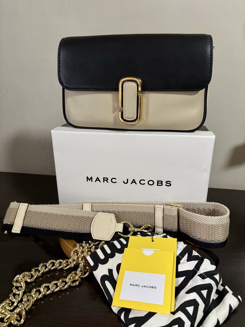 Marc Jacobs Shoulder Bag (Category: Luxury Bags & Wallets) located in Makati City. Submitted by andylooney (Listing ID 1461793784, Image 1). Description: Authentic Marc Jacobs bag Color - Greige multi * Adjustable chain and webbing strap, gold-tone designer logo, back slip pocket * Interior slip pocket, zip pocket * Snap-fastening front flap * Dimensions: H: 16cm x W: 25cm x D: 5cm. Handle Drop: 27cm. Strap Drop: 68cm. * Box, dust bag, bag tags i