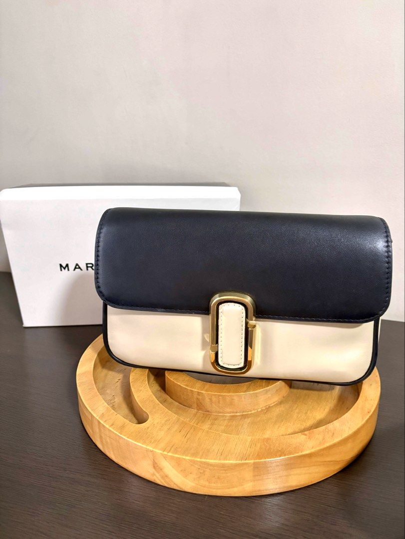 Marc Jacobs Shoulder Bag (Category: Luxury Bags & Wallets) located in Makati City. Submitted by andylooney (Listing ID 1461793784, Image 2). Description: Authentic Marc Jacobs bag Color - Greige multi * Adjustable chain and webbing strap, gold-tone designer logo, back slip pocket * Interior slip pocket, zip pocket * Snap-fastening front flap * Dimensions: H: 16cm x W: 25cm x D: 5cm. Handle Drop: 27cm. Strap Drop: 68cm. * Box, dust bag, bag tags i