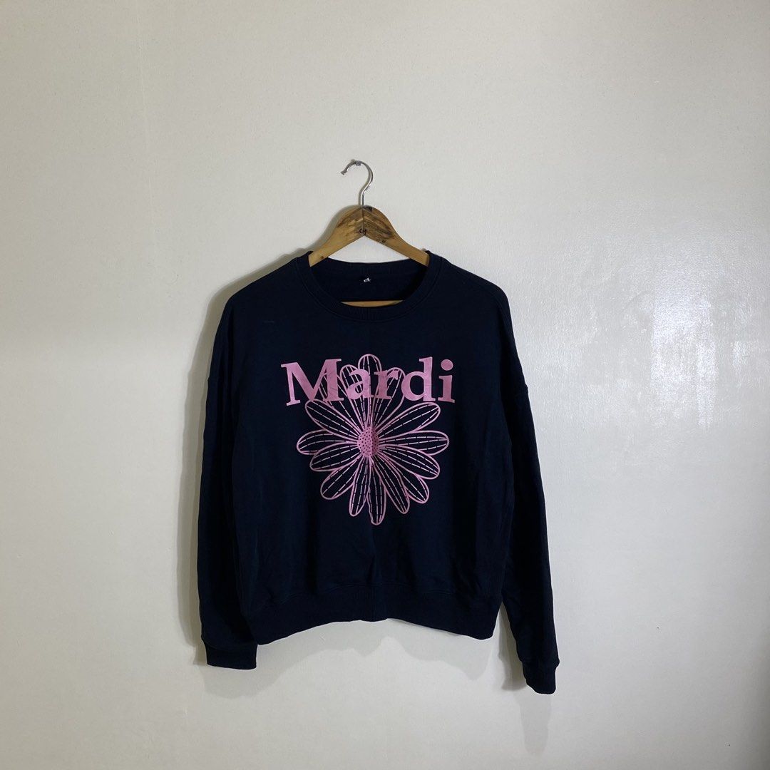Mardi Black Flower Print Sweatshirt (Category: Longsleeves) located in Cebu City. Submitted by theloose.thread (Listing ID 1461780898, Image 1). Description: - Stylish black sweatshirt featuring a vibrant pink Mardi flower graphic. - Classic crew neck and long sleeves for a comfortable fit. - Crafted from 100% cotton, ensuring breathability and softness. - Made in China. - Easy care instructions: wash cold, do not bleach, line dry, iron on low he