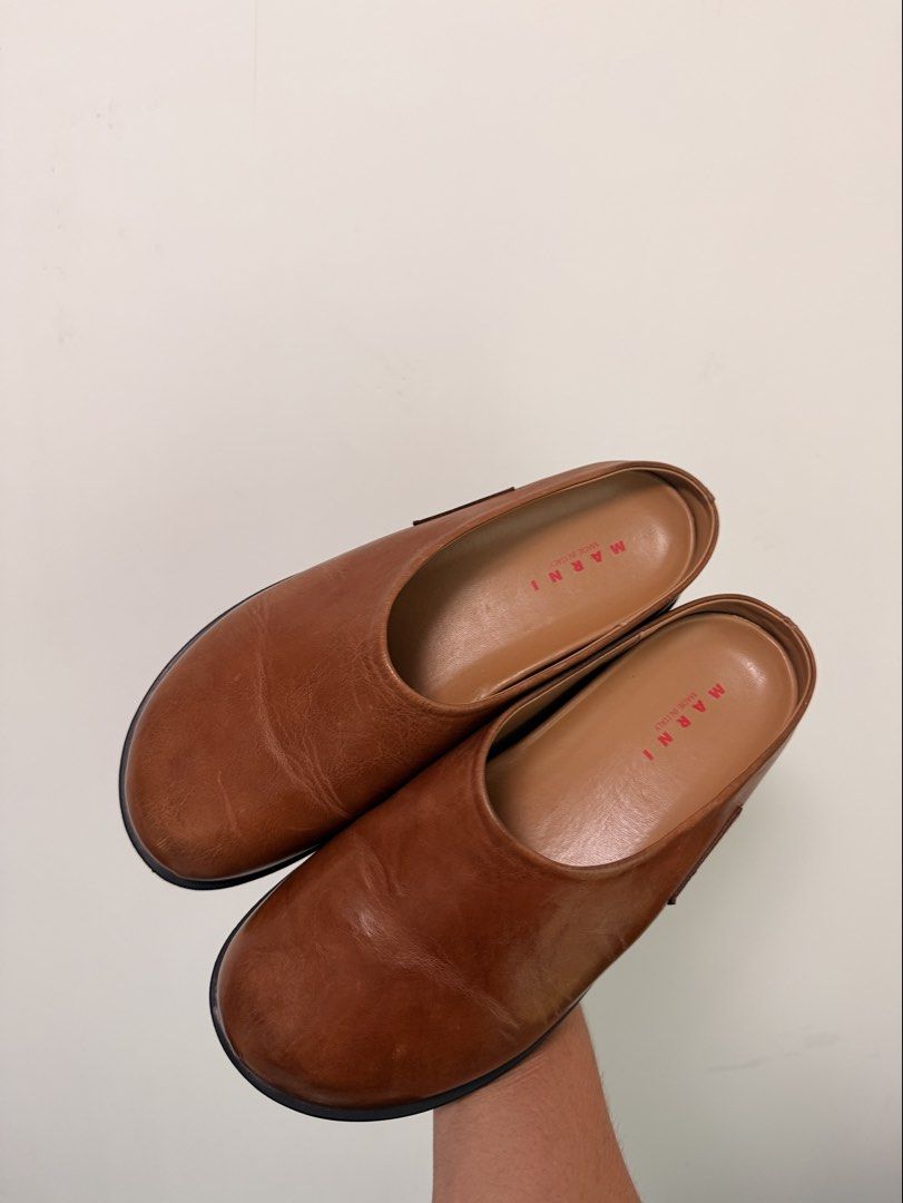 Marni fussbett leather mules (Category: Slippers and slides) located in Manila. Submitted by guziee (Listing ID 1461593832, Image 2). Description: Grained calfskin slip-on loafers. Logo patch at outer side. Buffed calfskin lining. Treaded rubber sole Upper: calfskin. Sole: rubber. Made in Italy. Size EU 40 | US MENS 7 or 9 WOMENS Suitable foot length as per website 10-10.25” / 25.5-26 cm Purchased for 1062 HKD ~8500 pesos Purchased from: https://