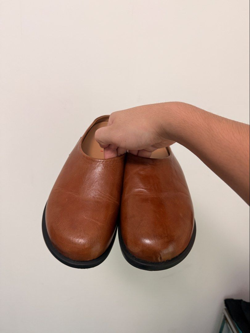 Marni fussbett leather mules (Category: Slippers and slides) located in Manila. Submitted by guziee (Listing ID 1461593832, Image 3). Description: Grained calfskin slip-on loafers. Logo patch at outer side. Buffed calfskin lining. Treaded rubber sole Upper: calfskin. Sole: rubber. Made in Italy. Size EU 40 | US MENS 7 or 9 WOMENS Suitable foot length as per website 10-10.25” / 25.5-26 cm Purchased for 1062 HKD ~8500 pesos Purchased from: https://