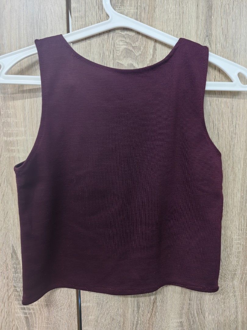 Maroon Sleeveless Crop Top (Category: Sleeveless) located in Las Pinas. Submitted by offtonewhome (Listing ID 1461564864, Image 2). Description: - Deep maroon sleeveless crop top - Ribbed fabric texture - Simple, classic cut - Versatile for layering or wearing on its own - Effortlessly pairs with jeans or skirts - Comfortable and easy to style.