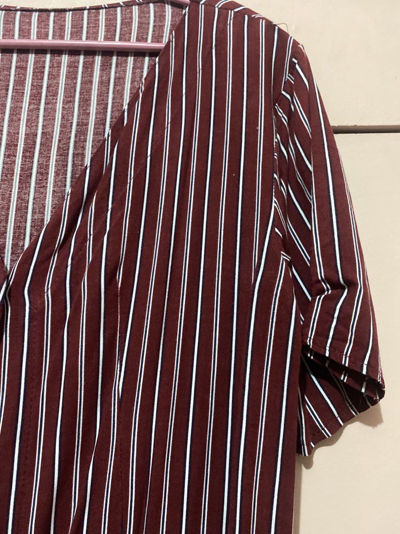 Maroon Striped Button-Up Midi Dress (Category: Dresses) located in Manila. Submitted by angelaay143 (Listing ID 1461772416, Image 3). Description: - Maroon dress with white vertical stripes - Button-up front - V-neckline - Short sleeves - Ideal for casual wear - Comfortable fabric - Easy to style - Needs laundry stored too long at the cabinet.