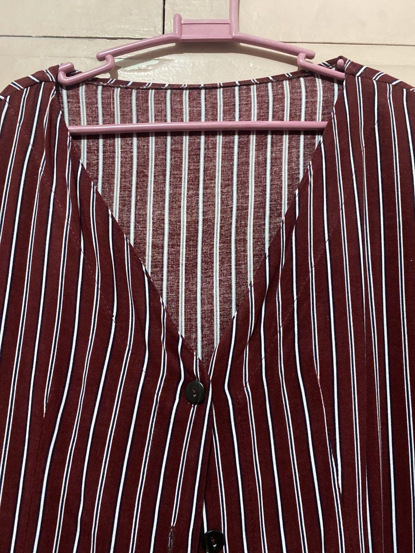 Maroon Striped Button-Up Midi Dress (Category: Dresses) located in Manila. Submitted by angelaay143 (Listing ID 1461772416, Image 2). Description: - Maroon dress with white vertical stripes - Button-up front - V-neckline - Short sleeves - Ideal for casual wear - Comfortable fabric - Easy to style - Needs laundry stored too long at the cabinet.