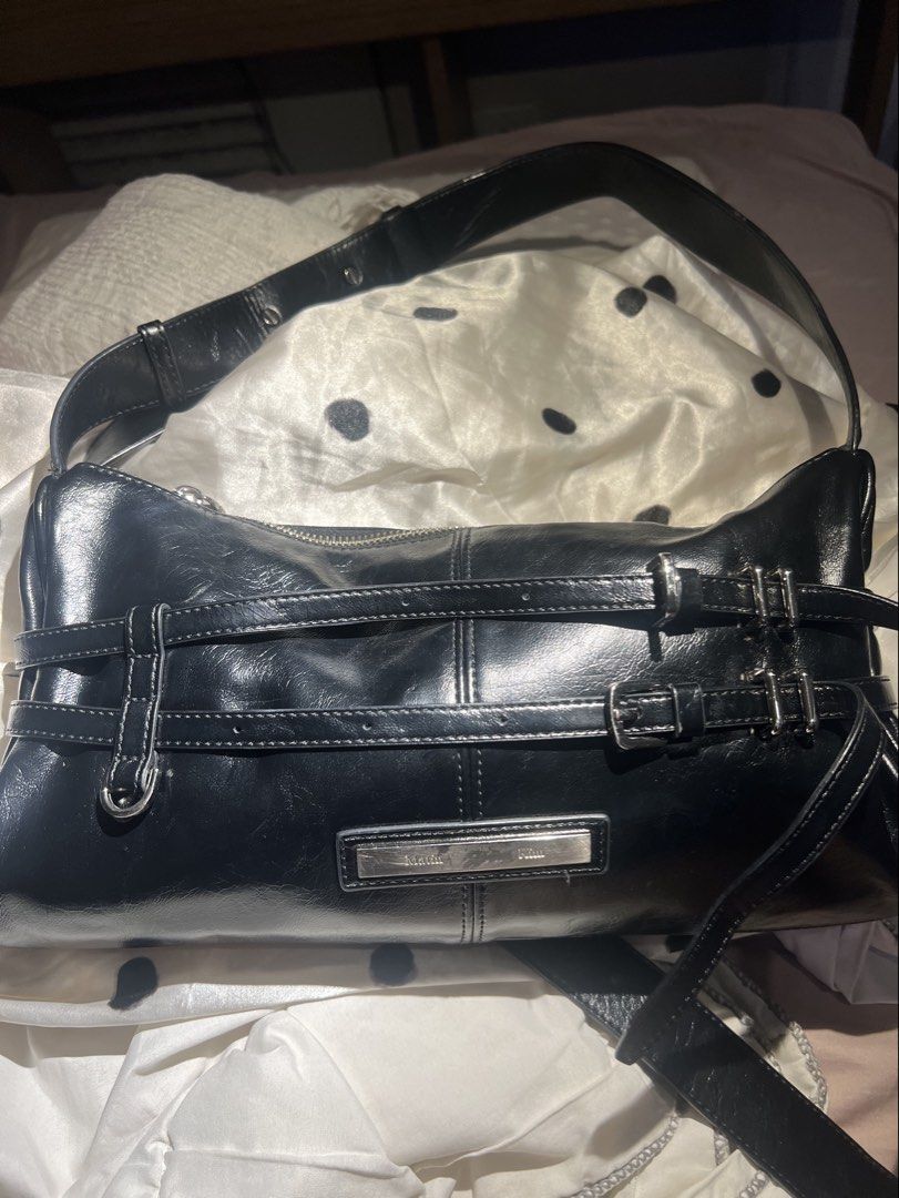 Matin Kim grunge shoulder bag black (Category: Shoulder Bags) located in Bacolod City. Submitted by mae.ll (Listing ID 1461671035, Image 2). Description: - Black handbag - Shows wear on corners - Zipper closure is intact - Suitable for everyday use, with minor cosmetic imperfections.