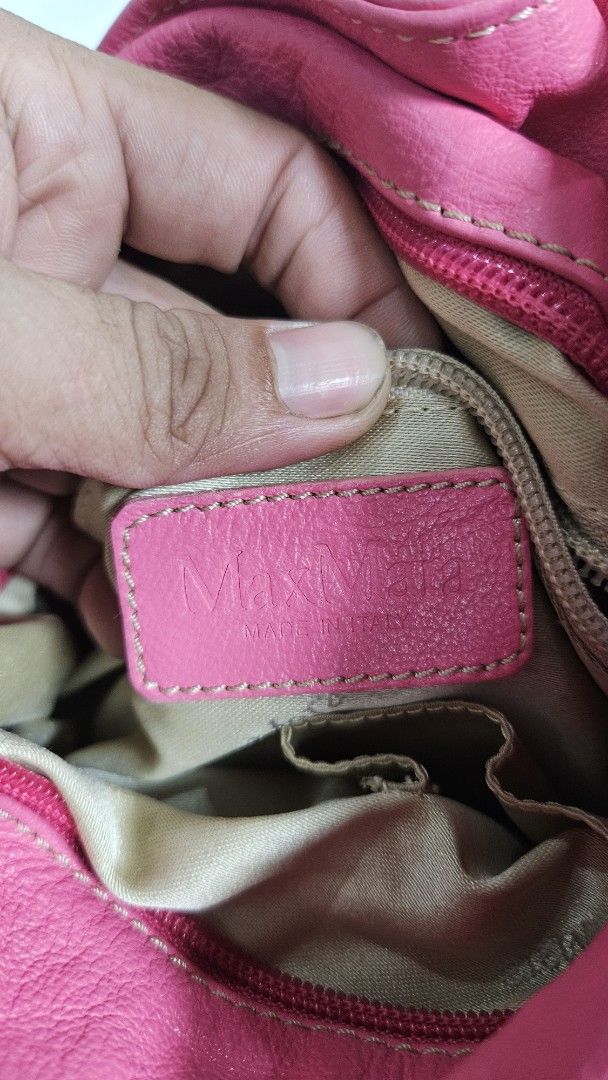Max mara Shoulder Bag (Category: Shoulder Bags) located in Alfonso. Submitted by jbcamet (Listing ID 1461712443, Image 3). Description: - Made in Italy - Soft leather with gathered detail - Multiple interior compartments for organization - Comfortable shoulder strap - Perfect for everyday use or adding a pop of color.