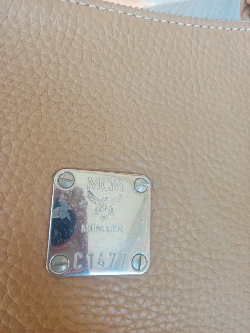 MCM München Leather Shoulder Bag (Category: Shoulder Bags) located in Bacoor. Submitted by aileen678s75866 (Listing ID 1461797619, Image 3). Description: - MCM tan leather shoulder bag - Features classic MCM logo plate and hardware - Spacious interior, perfect for everyday essentials.