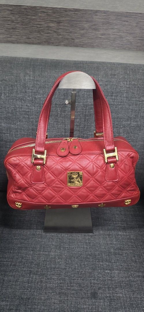 MCM Quilted Leather Satchel Handbag Red (Category: Shoulder Bags) located in General Trias. Submitted by roselle2230 (Listing ID 1461689318, Image 1). Description: - Authentic red MCM satchel bag - Luxurious quilted leather with elegant gold hardware - Features signature MCM logo plate and zipper pulls - Interior lined with vibrant red fabric - Crafted in Korea - Ideal for everyday use and adding a pop of color to your outfits.