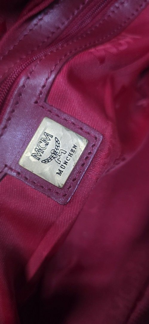 MCM Quilted Leather Satchel Handbag Red (Category: Shoulder Bags) located in General Trias. Submitted by roselle2230 (Listing ID 1461689318, Image 3). Description: - Authentic red MCM satchel bag - Luxurious quilted leather with elegant gold hardware - Features signature MCM logo plate and zipper pulls - Interior lined with vibrant red fabric - Crafted in Korea - Ideal for everyday use and adding a pop of color to your outfits.