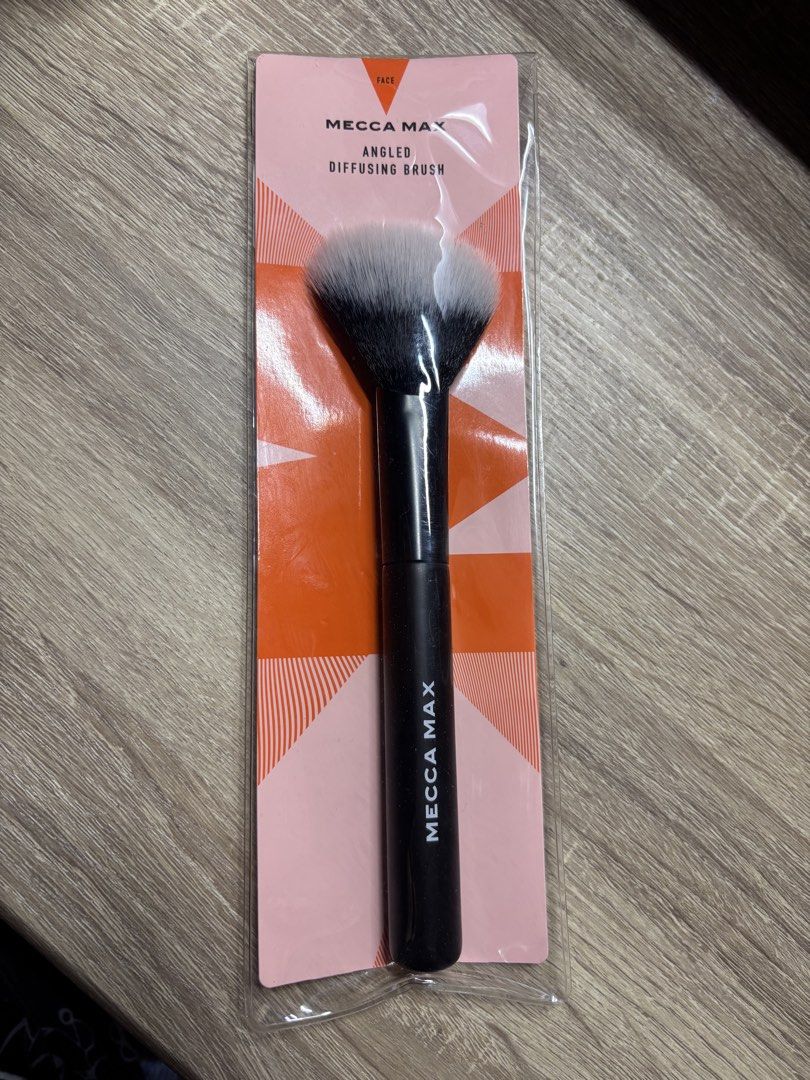 MECCA MAX Angled Diffusing Brush (Category: Makeup) located in Davao. Submitted by mielle_888 (Listing ID 1461605641, Image 1). Description: ‼️Brand new ‼️ - MECCA MAX Angled Diffusing Brush (Brush ID: 10) - Medium, angled, tapered shape - Perfect for sculpted cheeks - Ideal for diffusing and setting makeup - Great for blending powders, blushes, and bronzers - 100% vegan and cruelty-free.