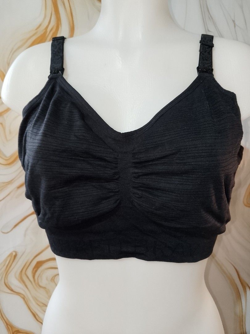 MEDIUM TO LARGE cup c to dd Black Nursing Bra with Clasp Release (Category: Undergarments & Loungewear) located in Manila. Submitted by truecrystal-1407 (Listing ID 1461658009, Image 2). Description: - Comfortable black nursing bra - Easy clasp release for convenient feeding - Adjustable straps with a decorative pattern - Soft fabric for all-day comfort - Provides excellent support for new moms.