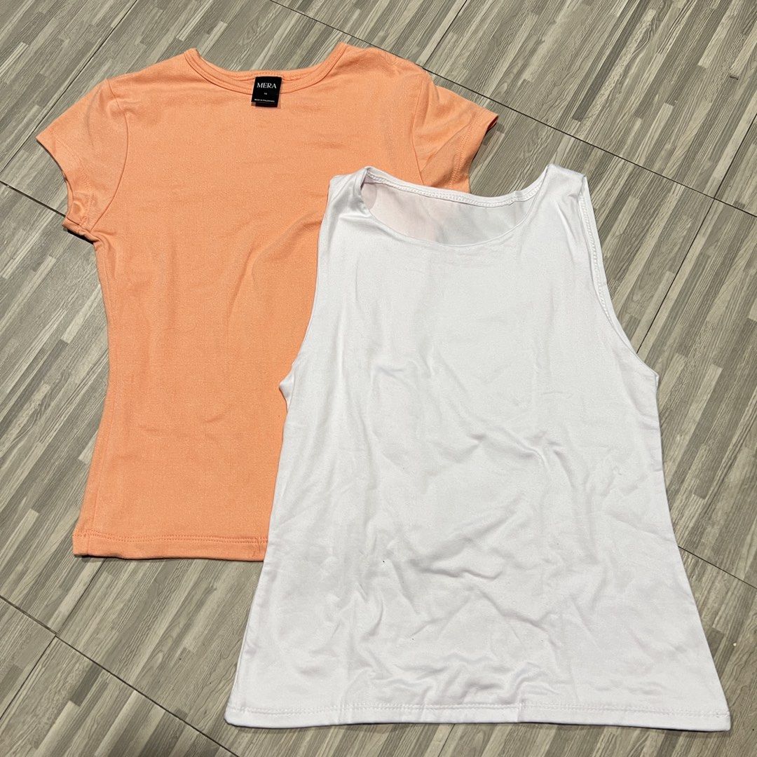 Mera Shirt & White Tank Top Bundle (Category: Shirts) located in Las Pinas. Submitted by veamesia_ (Listing ID 1461564301, Image 1). Description: - Bundle includes: 1 peach short-sleeved t-shirt (Mera) and 1 white sleeveless tank top. - Ideal for everyday wear, casual outings, or layering. ‼️Used once/Preloved ‼️ XS on tag .