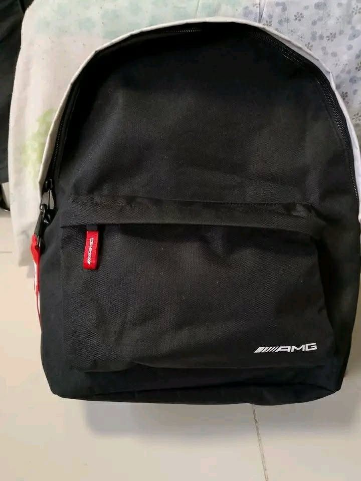 Mercedes-Benz AMG Backpack Black White Red (Category: Backpacks) located in Manila. Submitted by wildwind_73f77a (Listing ID 1461640254, Image 1). Description: - Black and white backpack with striking red accents. - Features the iconic AMG logo on the front. - Comes with a cool red keychain. - Adjustable red straps for a comfortable fit. - Spacious interior for all your essentials. - Ideal for everyday use or your next adventure..