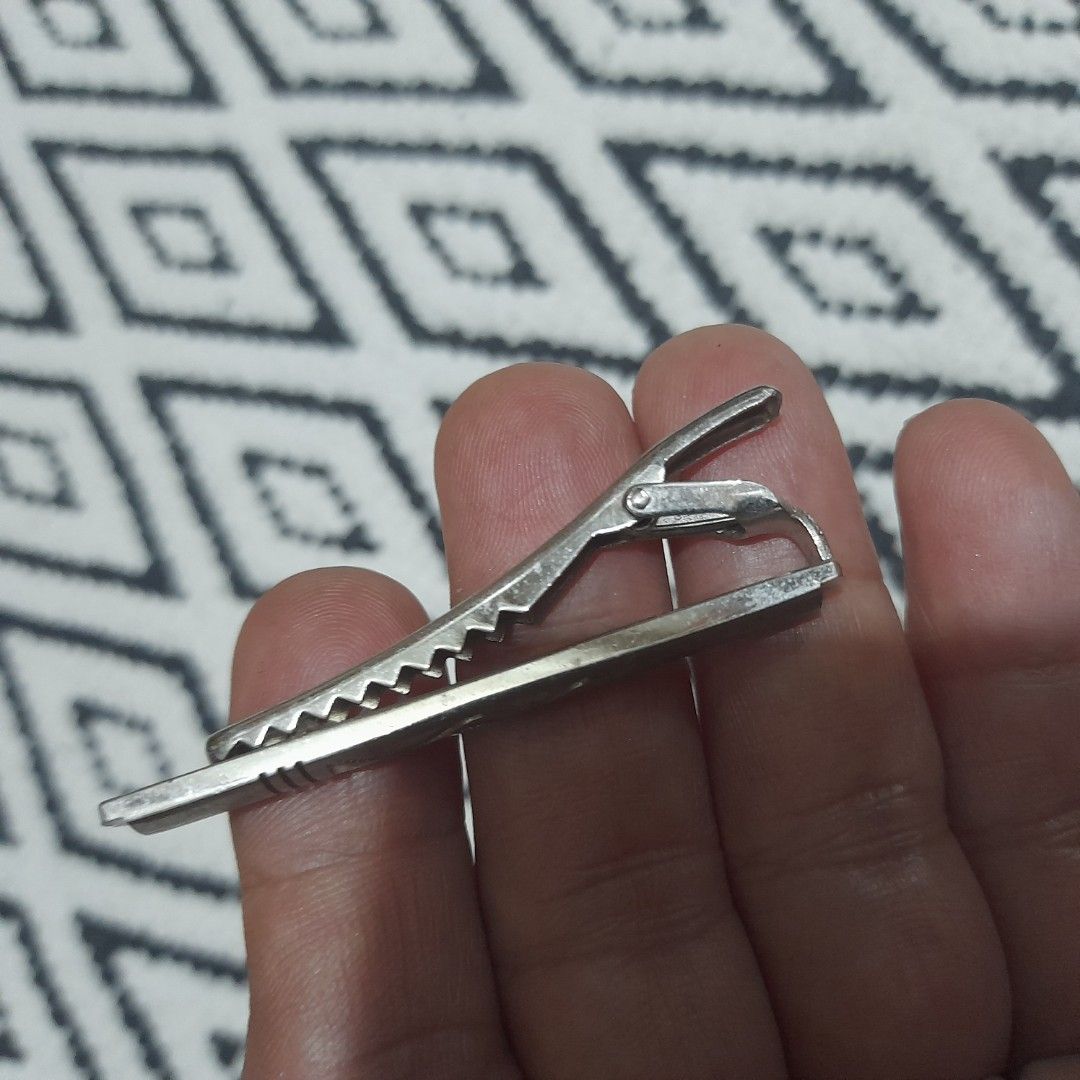 Metal Tie Clip (Category: Ties) located in Bocaue. Submitted by marajapansurplus (Listing ID 1461686016, Image 3). Description: - Classic metal tie clip - Silver-tone finish - Features a subtle wave design and line details - Adds a touch of sophistication to any outfit - selling as it is - Japan sourced item.