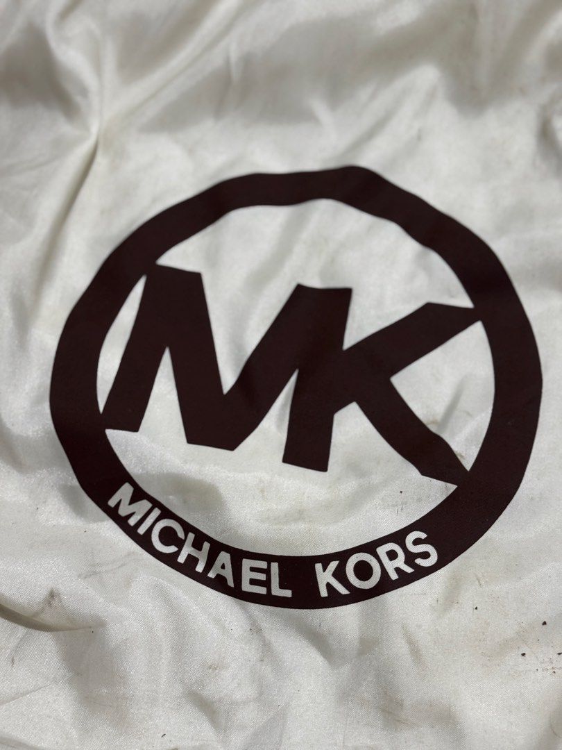Michael Kors Black Leather Tote Bag (Category: Tote Bags) located in Bauang. Submitted by jeneefromtheblock (Listing ID 1461774505, Image 2). Description: - Original Black Michael Kors tote bag - Genuine leather material - Elegant gold hardware details - Convenient exterior side pockets - Spacious interior with multiple compartments - Signs of wear on bottom corners and some marks on the front - Comes with original dust bag - Ideal everyday bag.