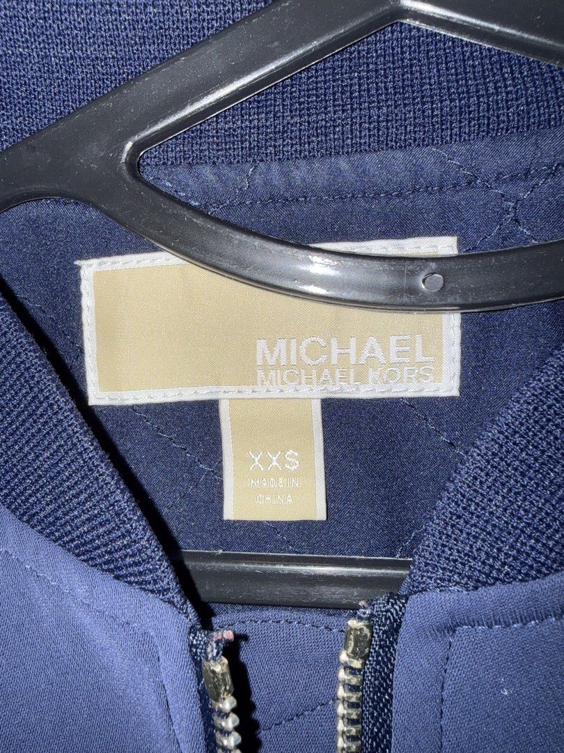 Michael Kors Bomber Jacket Navy White XXS (Category: Coats, Jackets and Outerwear) located in San Pedro. Submitted by artiizzza (Listing ID 1461599725, Image 3). Description: - Michael Kors navy and white bomber jacket - Raglan sleeves with arm stripes - Ribbed cuffs and hem - Minor stains on white sleeves (visible in last two photos) !!Delivery fee shouldered by buyer.