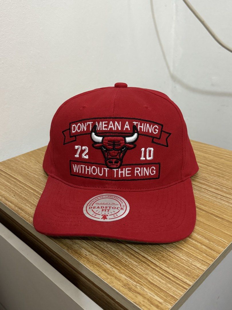 Mitchell & Ness Chicago Bulls "72 10" Snapback Cap (Category: Caps & Hats) located in Bulacan. Submitted by alshopie (Listing ID 1461630820, Image 1). Description: - Authentic Mitchell & Ness Chicago Bulls snapback cap - Features the 'Don't Mean a Thing Without the Ring' slogan - Commemorates the legendary 72-10 record - Deadstock fit for a classic look - One size fits all - A must-have for any dedicated Bulls fan.