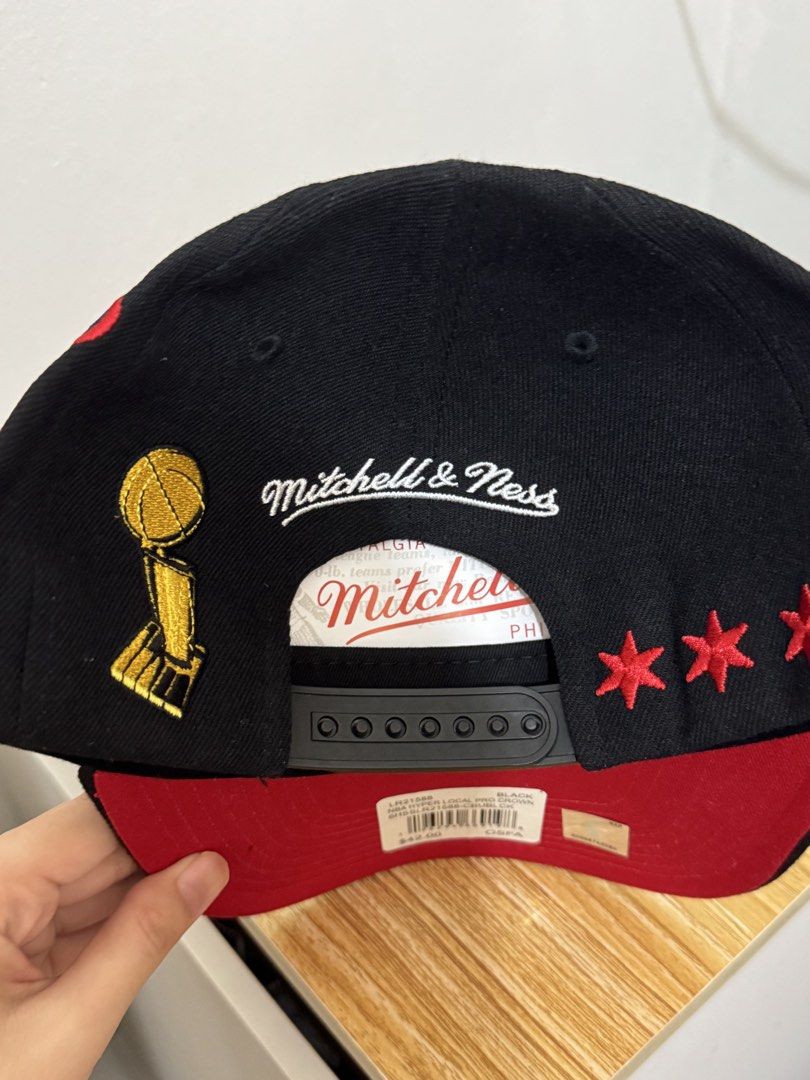 Mitchell & Ness Chicago Bulls NBA Finals 1996 Cap (Category: Caps & Hats) located in Bulacan. Submitted by alshopie (Listing ID 1461628297, Image 3). Description: - Mitchell & Ness Chicago Bulls Cap - Commemorates the 1996 NBA Finals - Features 'Chicago' text and Interstate 90 patches - Includes NBA Finals logos and championship trophy graphic - Red underbrim and red accents - Adjustable snapback closure - One Size Fits All (OSFA).