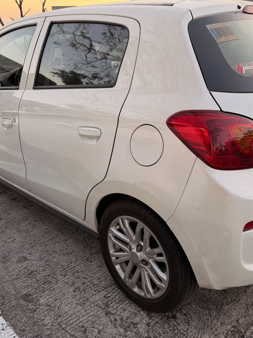 Mitsubishi Attrage Mirage Hatchback Auto (Category: Used Cars) located in Quezon City. Submitted by chriscuenca06 (Listing ID 1461669037, Image 3). Description: For Sale: Mitsubishi Mirage Hatchback GLX 2018 - Acquired March 2019. Pearl White 1.2L 3A92 Mivec Gas Engine. Casa Maintained from Day 1. Complete Casa Record via Casa Booklet. Manual included Registered Till June 2027 - Ako po owner and seller Upgrades and Maintenance: Thick Tires G4 15’