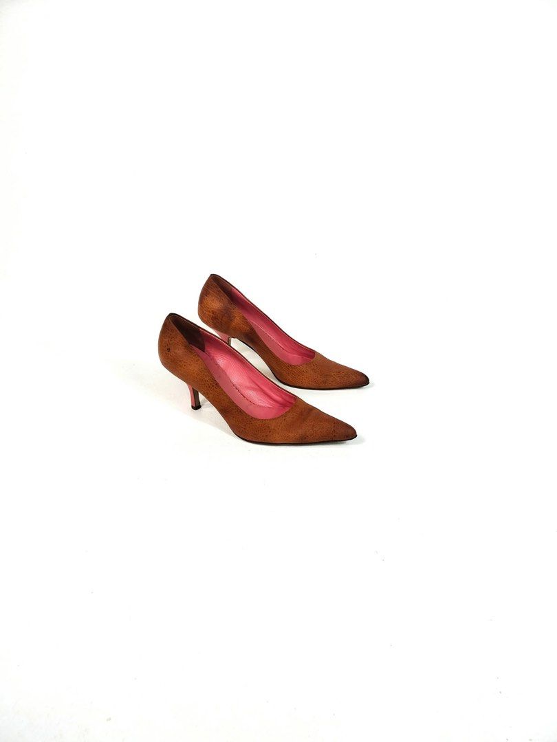 MIU MIU Brown Suede Pointed Toe Heels (Category: Heels) located in Manila. Submitted by yesterdaysfinds (Listing ID 1461711902, Image 2). Description: - Brown suede material - Elegant pointed toe design - Bright pink interior lining - Comfortable low heel height - Versatile for dressing up or down - Classic shoe style that pairs with many outfits CONDITION📌 - Signs if used.