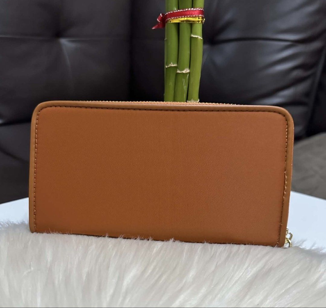 Miu Miu Wallet (Category: Luxury Bags & Wallets) located in Mandaue City. Submitted by ludz_0246 (Listing ID 1461715141, Image 2). Description: Miumiu Zipper Puller In Tan Card and Coin Slot Nylon With box No Issue.