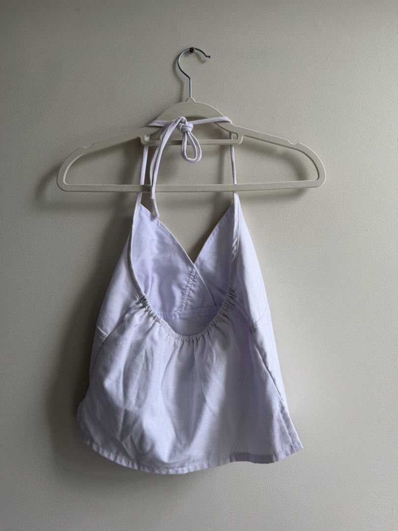 Miu The Label White Halter Top (Category: Sleeveless) located in Makati City. Submitted by andy0019 (Listing ID 1461613287, Image 2). Description: has a tiny makeup stain that can be washed never used size xs but can fit xs - s .