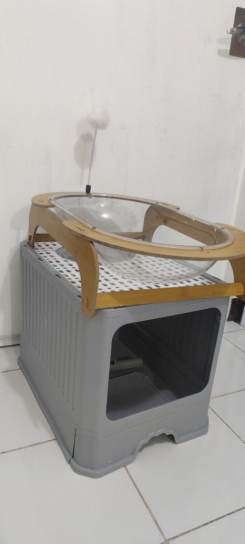 Cat Litter Box and Cat Bed Set (Category: Shelves, Cabinets & Racks) located in Caloocan City. Submitted by simplyliving_31 (Listing ID 1461797147, Image 3). Description: - Modern grey cat litter box enclosure - Large opening for easy pet access - Includes a convenient litter scoop -Aesthetic cat bed +Shipping Fee -Loc: Ortigas Extension.