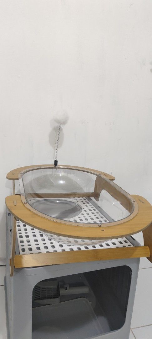 Cat Litter Box and Cat Bed Set (Category: Shelves, Cabinets & Racks) located in Caloocan City. Submitted by simplyliving_31 (Listing ID 1461797147, Image 2). Description: - Modern grey cat litter box enclosure - Large opening for easy pet access - Includes a convenient litter scoop -Aesthetic cat bed +Shipping Fee -Loc: Ortigas Extension.