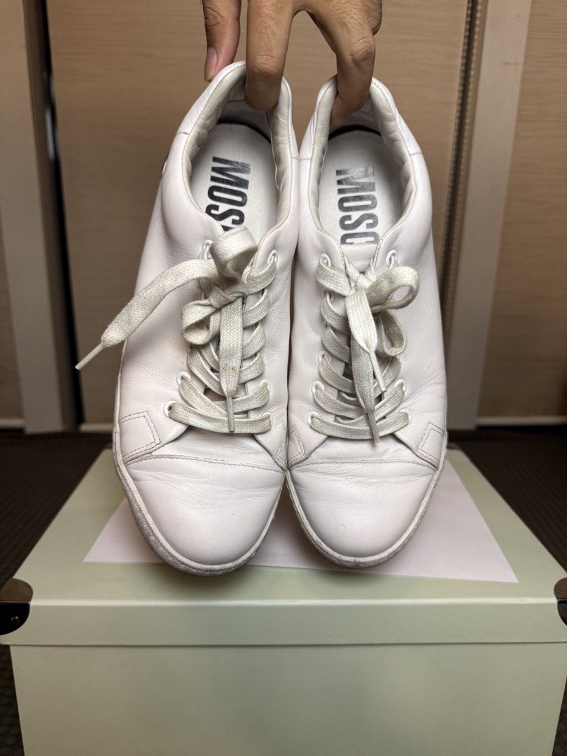 Moschino White Leather Sneakers (Category: Casual Shoes) located in Manila. Submitted by kuyascloset (Listing ID 1461692349, Image 3). Description: - Authentic Moschino white leather sneakers - Features iconic Moschino logo on heel and inner sole - Classic lace-up closure - Ideal for everyday casual wear.