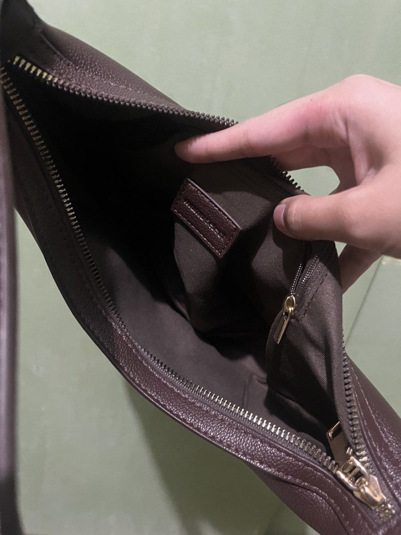 MUMUSELECT Brown Leather Hobo Shoulder Bag (Category: Shoulder Bags) located in Manila. Submitted by myth.rifts (Listing ID 1461782614, Image 3). Description: - Brand: MUMUSELECT - Type: Hobo Bag - Material: Brown Leather - Closure: Zipper - Interior: Small zip pocket - Features: Pebbled texture, adjustable strap - Best for: Everyday use.