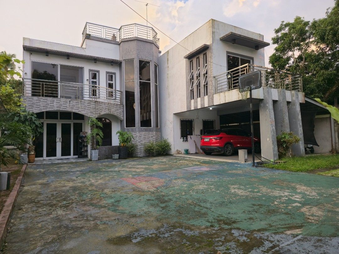 My Dream House (Category: House & Lot) located in Manila. Submitted by cosmictiger_d9dcb2 (Listing ID 1461680882, Image 1). Description: Property Features: - 600 sq. m. lot area - 6 rooms - 4 comfort rooms (CR) - 3-storey house with a roof deck - Mini gym - Fully fenced and gated property - CCTV coverage around the entire area - Carport for 3–4 vehicles - Half-court basketball area.
