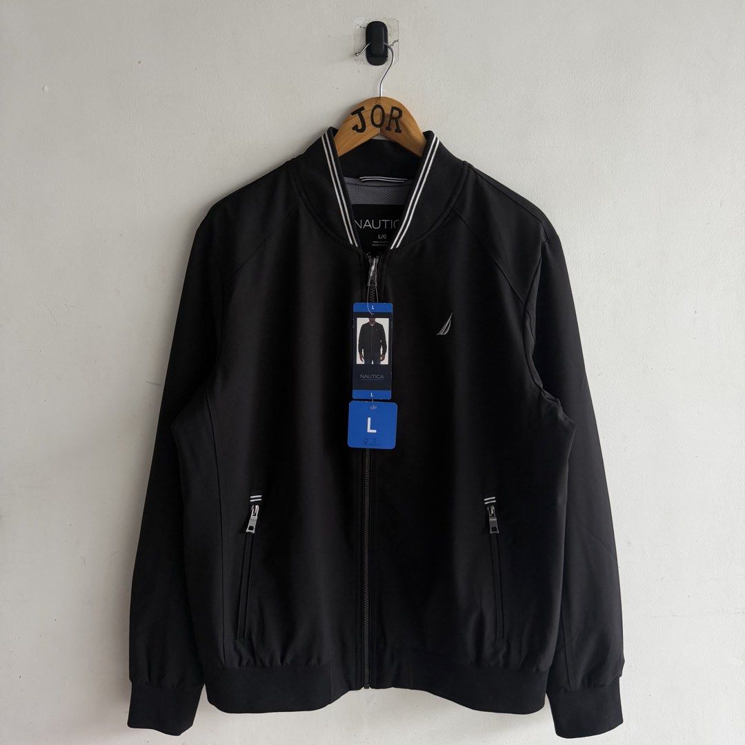Nautica Water Resistant Bomber Jacket (Category: Coats, Jackets and Outerwear) located in San Fernando. Submitted by jorjorr (Listing ID 1461743414, Image 2). Description: Nautica Water Resistant Bomber Jacket Brand new w/ hangtag Original 💯 Large on tag 25 width 29 length Best fit large to xl No issue P2,499.
