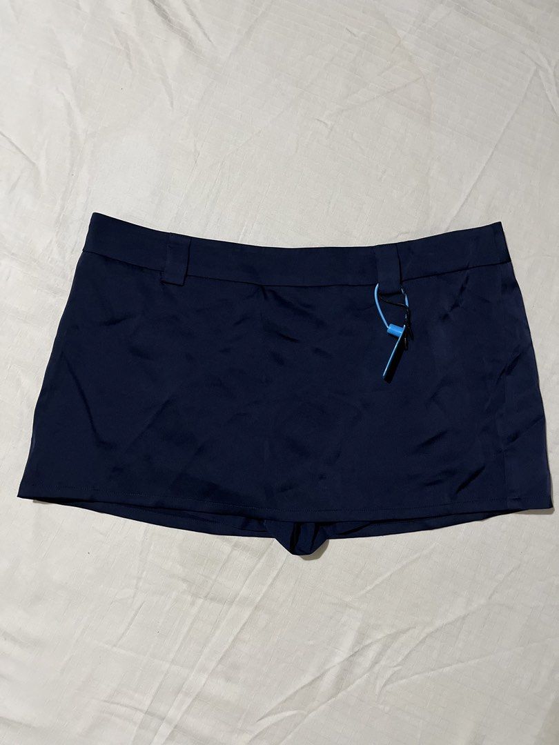 Navy Blue Mini Skirt with Inner Shorts (Category: Skirts) located in Quezon City. Submitted by earthtodior (Listing ID 1461795551, Image 1). Description: - Navy blue mini skirt - XS to Small - Bright blue side drawstring detail - Fabric has a slight sheen - Ideal for casual outfits.