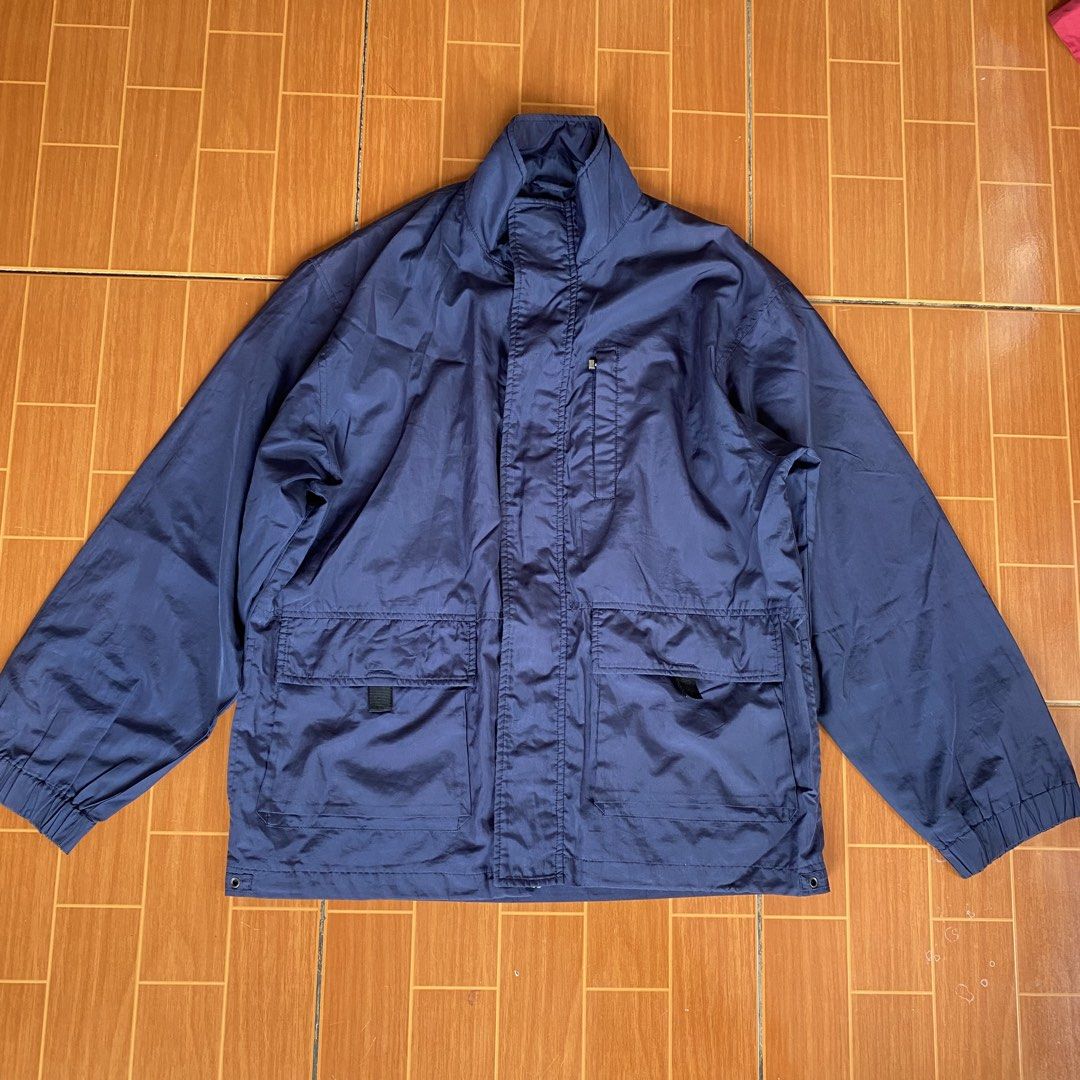 Navy Blue Zip-Up Jacket with Pockets (Category: Coats, Jackets and Outerwear) located in Makati City. Submitted by eunaj (Listing ID 1461657926, Image 1). Description: - Classic navy blue jacket - Zip-up front with stand-up collar - Two large front pockets with button closures - Elasticated cuffs and hem - Ideal for layering or as light outerwear - Simple and functional design - NEEDS WASHING‼️ - ISSUE: BROKEN ZIPPER.