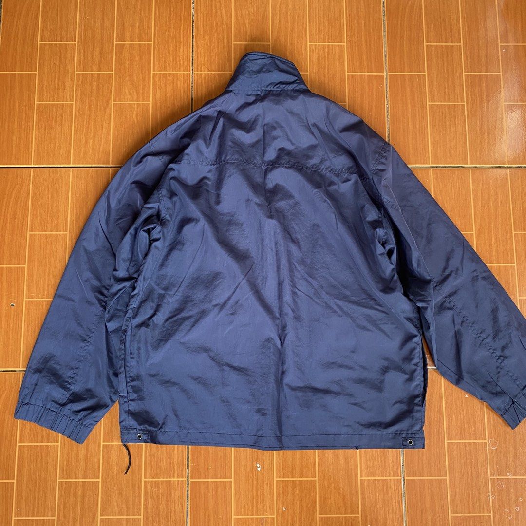 Navy Blue Zip-Up Jacket with Pockets (Category: Coats, Jackets and Outerwear) located in Makati City. Submitted by eunaj (Listing ID 1461657926, Image 2). Description: - Classic navy blue jacket - Zip-up front with stand-up collar - Two large front pockets with button closures - Elasticated cuffs and hem - Ideal for layering or as light outerwear - Simple and functional design - NEEDS WASHING‼️ - ISSUE: BROKEN ZIPPER.