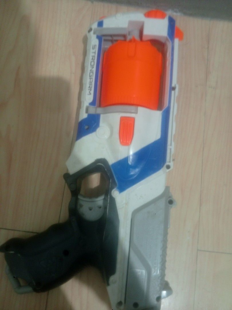 Nerf N-Strike Elite Strongarm Blaster (Category: Action & Battle Toys) located in Manila. Submitted by gian_ocampo (Listing ID 1461783926, Image 2). Description: Original Nerf Strongarm — 6-dart rotating barrel. Used but fully working: priming & firing smooth, no jams. Has normal dust & light scuffs, no cracks or broken parts. Clean & ready to use. Darts not included. .