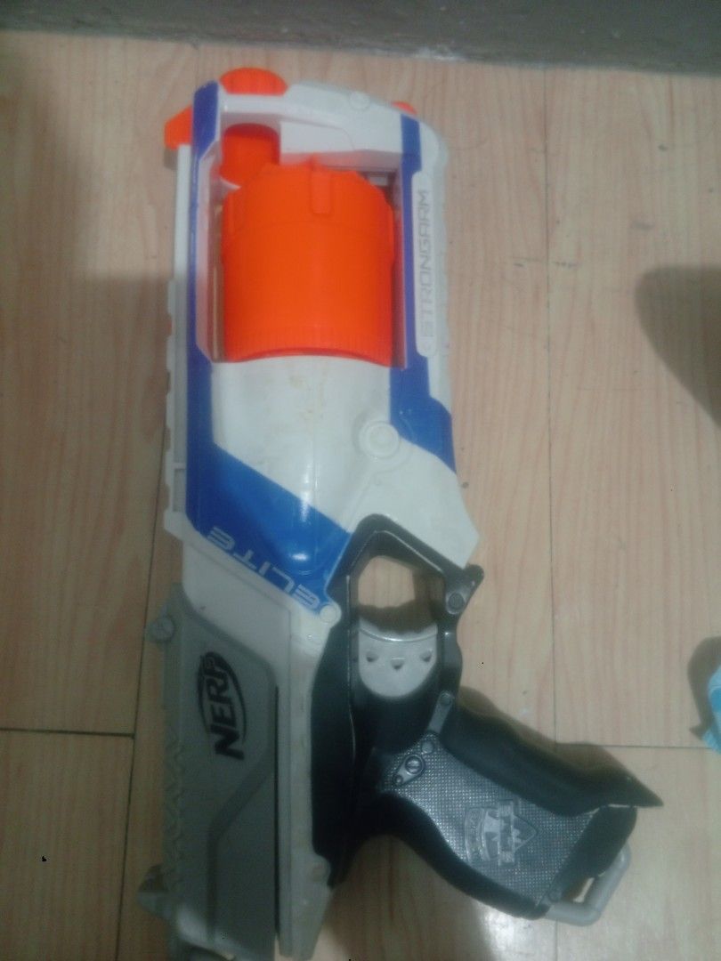 Nerf N-Strike Elite Strongarm Blaster (Category: Action & Battle Toys) located in Manila. Submitted by gian_ocampo (Listing ID 1461783926, Image 1). Description: Original Nerf Strongarm — 6-dart rotating barrel. Used but fully working: priming & firing smooth, no jams. Has normal dust & light scuffs, no cracks or broken parts. Clean & ready to use. Darts not included. .