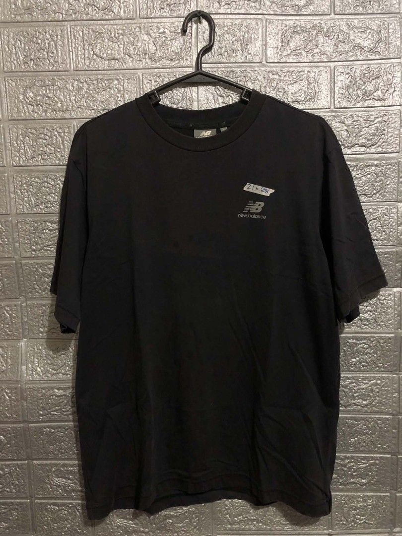New Balance Shirt (Category: Earphones) located in Manila. Submitted by wildshark-33d3 (Listing ID 1461769868, Image 1). Description: Authentic Good condition issue check last picture / minimal hairline logo sa back print.